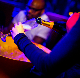 Celebratory champagne pouring scene